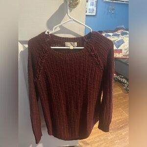 Burgundy sweater with stitching on sleeves